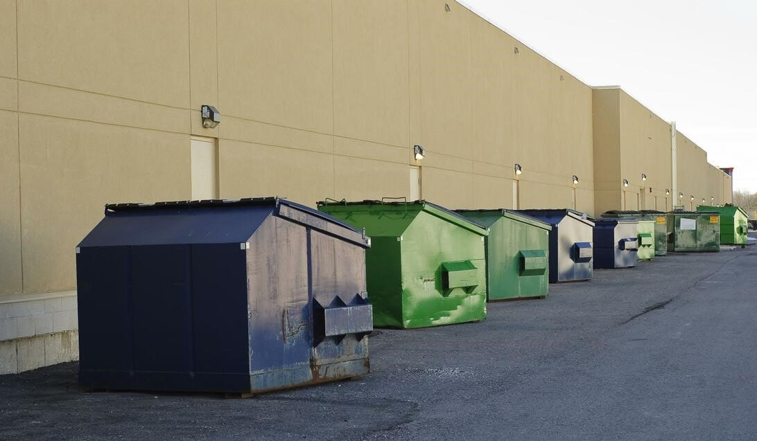 green and blue trash bins for commercial use